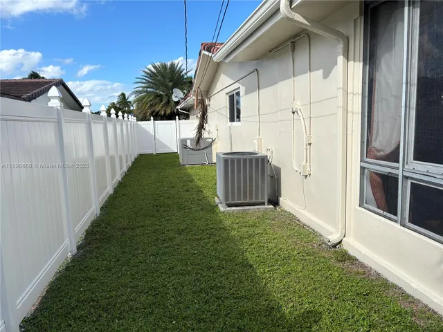a view of a back yard of the house