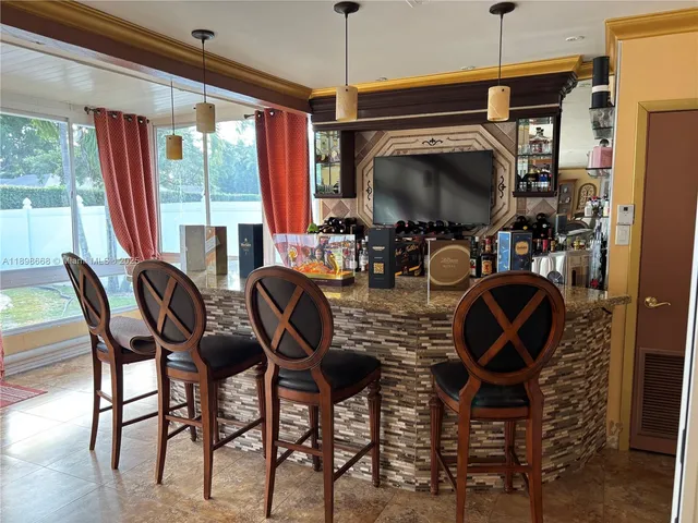 a view of a dining room with furniture window and outside view