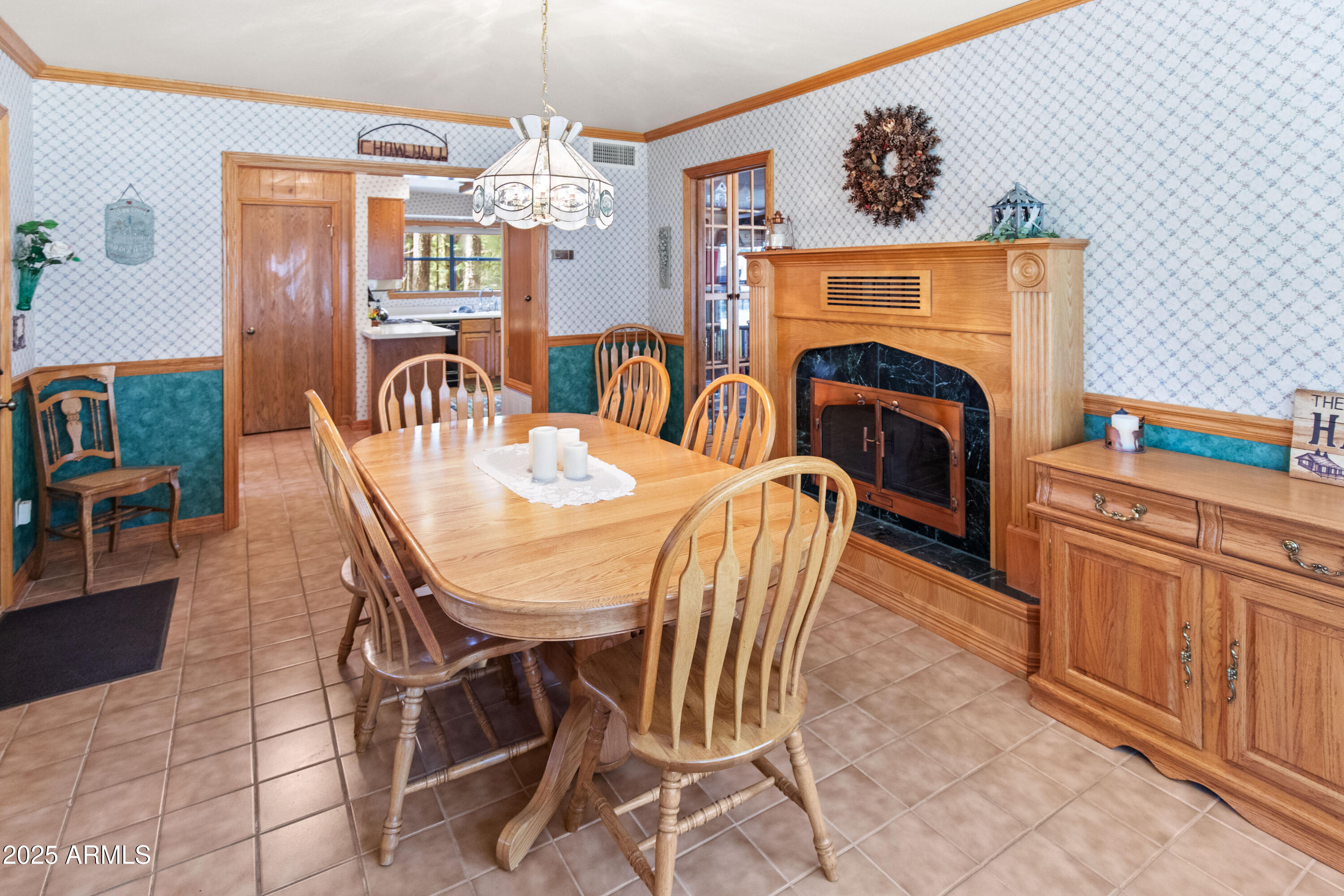 3910 Larson Loop Forest Lakes, AZ 85931 - Photo 18 of 57 a view of a dining room with furniture a chandelier and wooden floor
