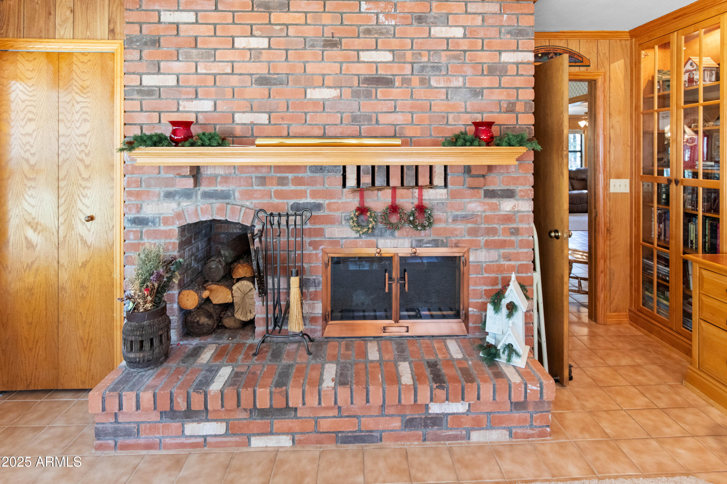 3910 Larson Loop Forest Lakes, AZ 85931 - Photo 23 of 57 a picture of a living room with a fireplace and a floor to ceiling window
