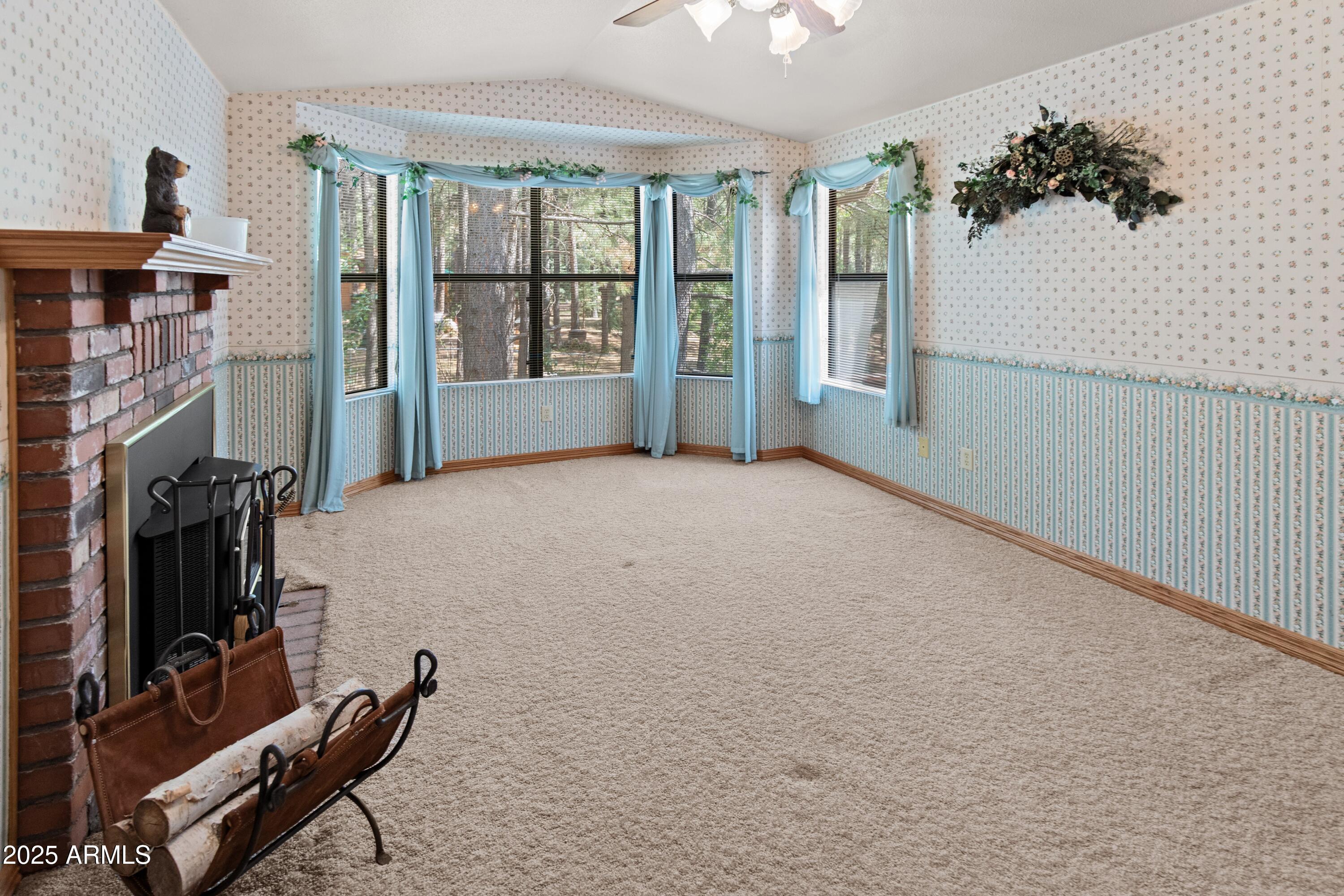 3910 Larson Loop Forest Lakes, AZ 85931 - Photo 33 of 57 a view of a room with gym equipment and windows
