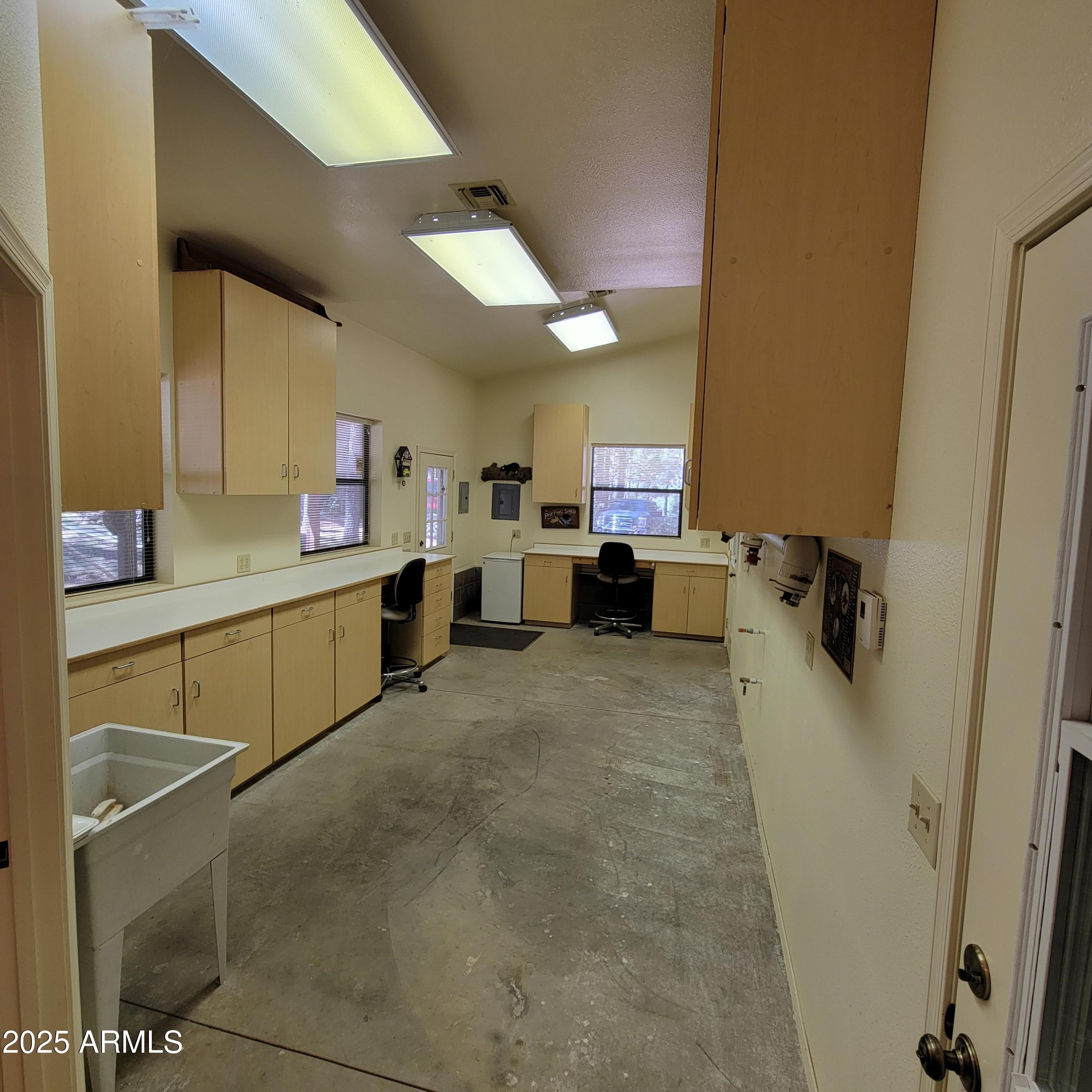 3910 Larson Loop Forest Lakes, AZ 85931 - Photo 48 of 57 a room with a sink storage and utility