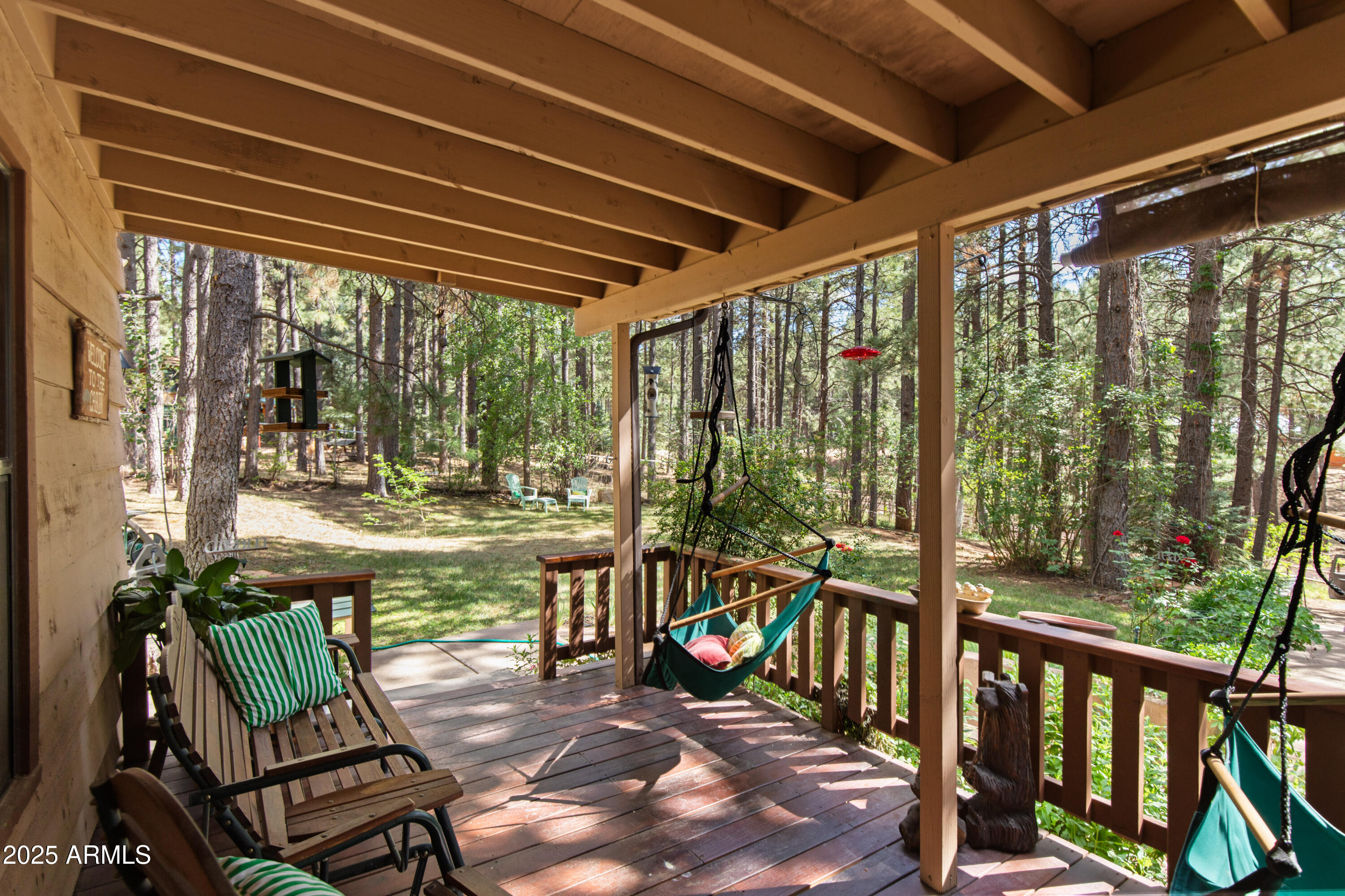 3910 Larson Loop Forest Lakes, AZ 85931 - Photo 6 of 57 a view of a balcony with chairs and wooden floor
