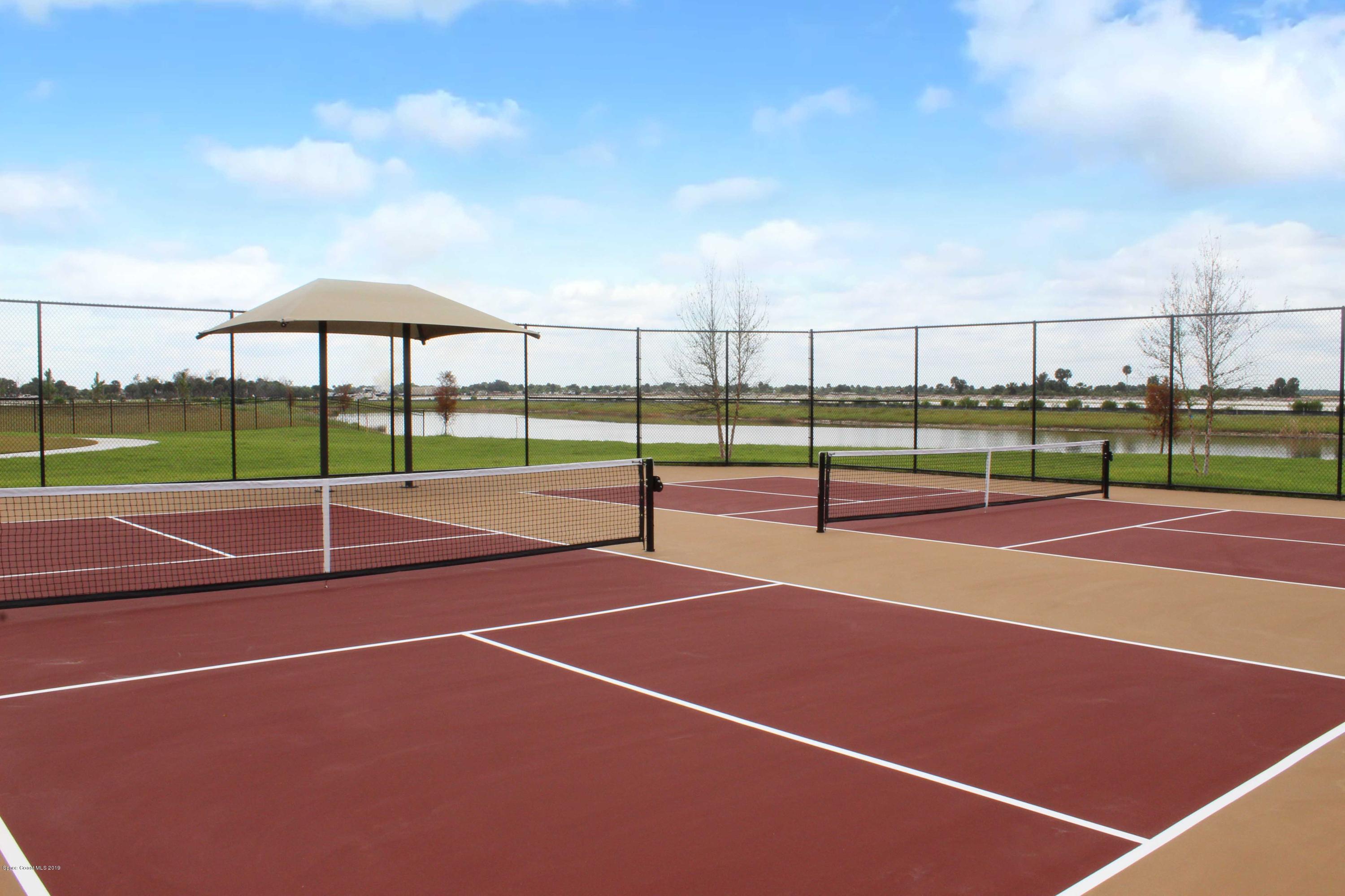 3094 Hummingbird Way Melbourne, FL 32940 - Photo 28 of 35 a view of an outdoor space and tennis court
