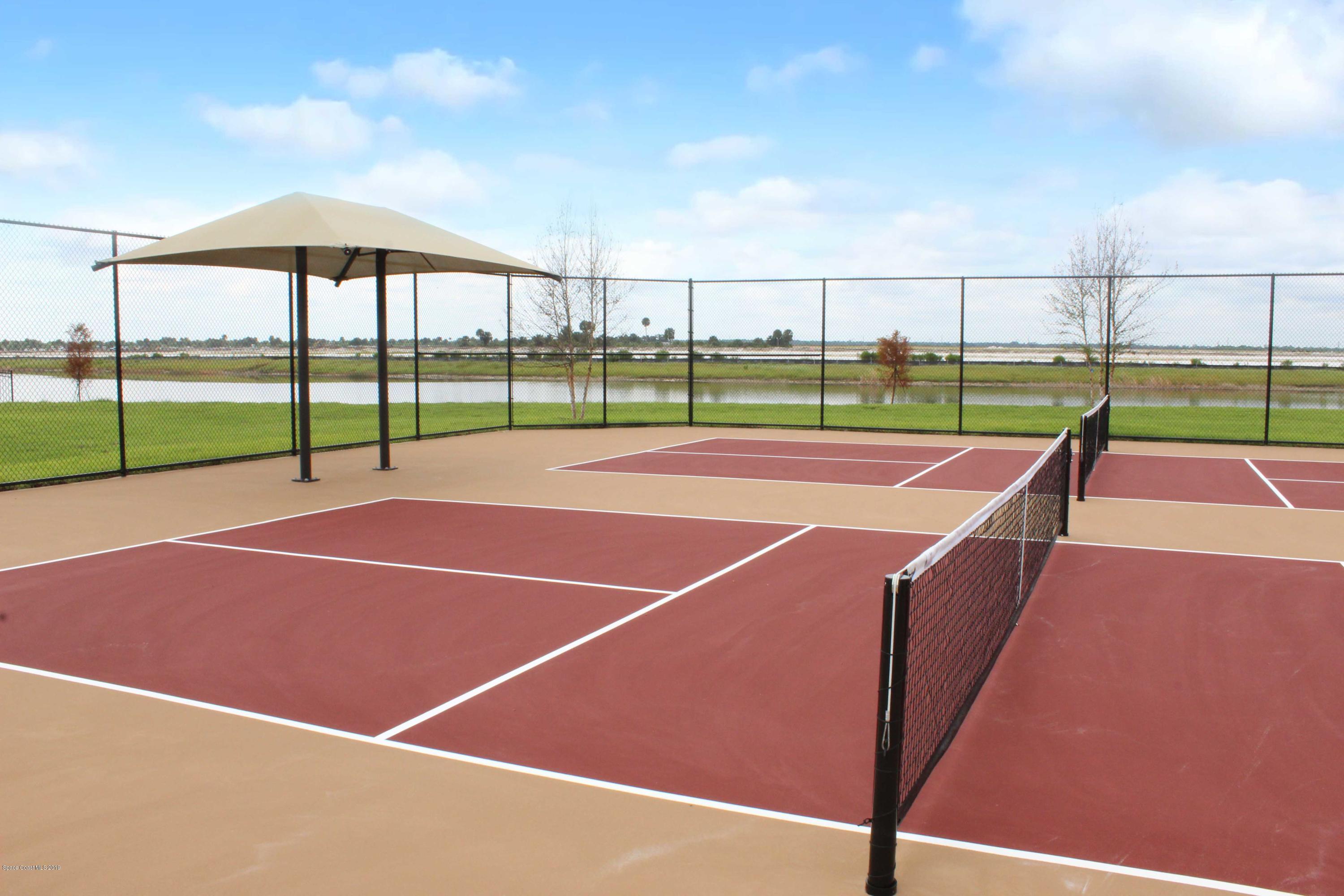 3094 Hummingbird Way Melbourne, FL 32940 - Photo 29 of 35 a tennis court that has tennis net