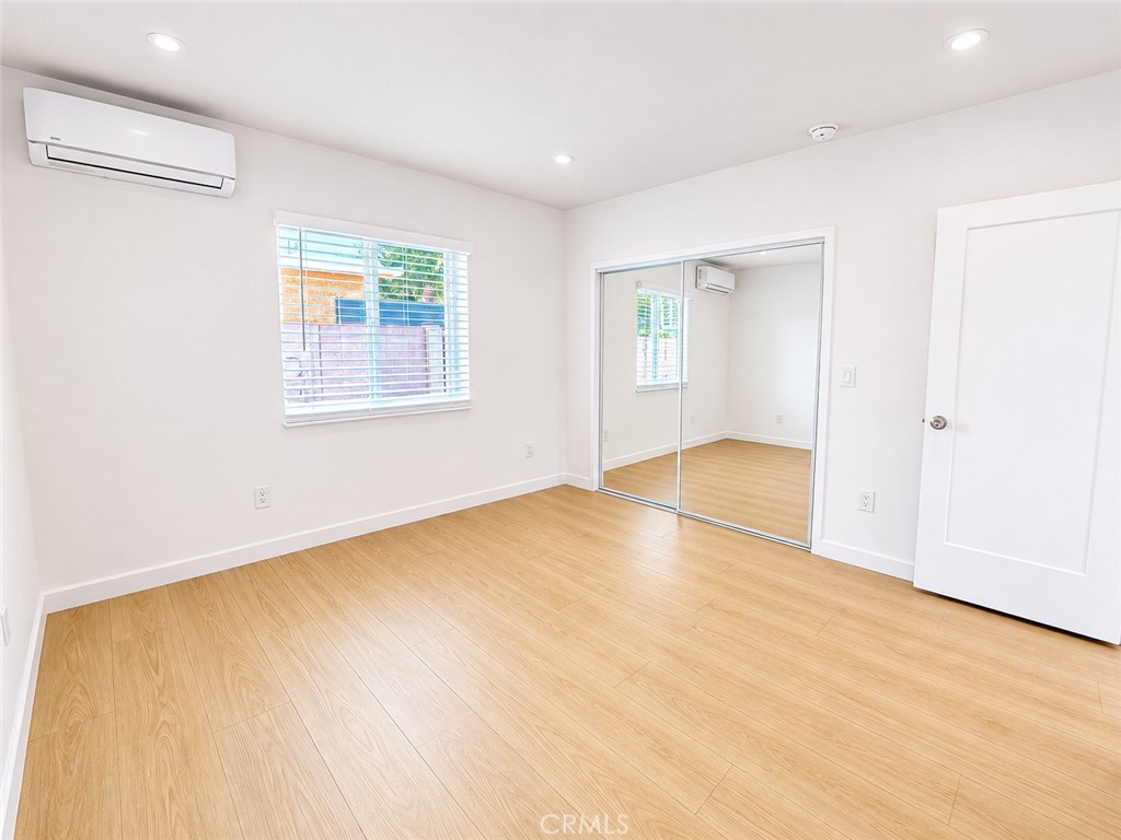 18924 Vose Street Reseda, CA 91335 - Photo 6 of 8 a view of empty room with wooden floor and fan