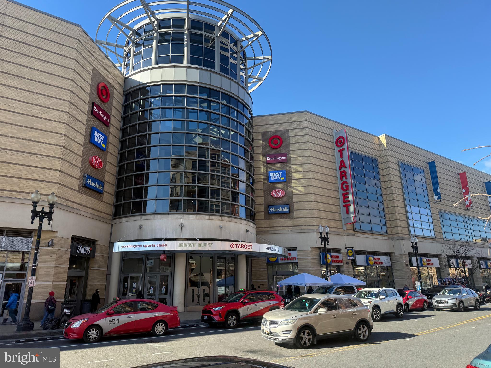 1020 Monroe Street Northwest, Unit 204 Washington, DC 20010 - Photo 29 of 30 a front view of a building with lot of cars and trees