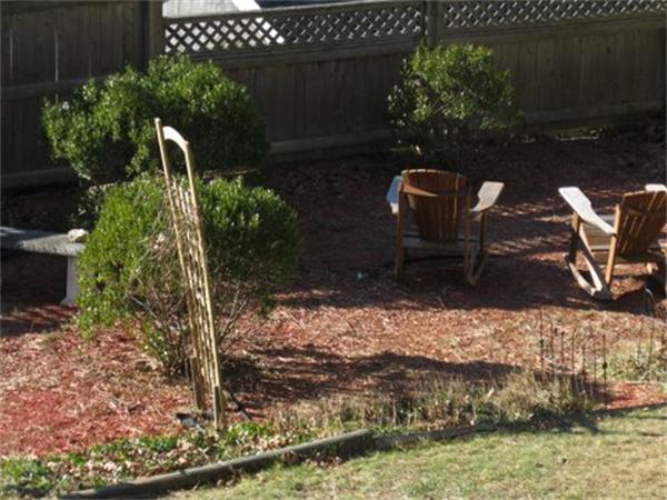 327 Mayfair Road Yarmouth, MA 02675 - Photo 20 of 29 a backyard of a house with lots of green space