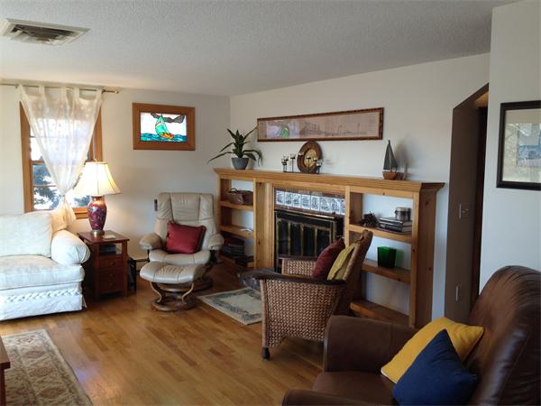 327 Mayfair Road Yarmouth, MA 02675 - Photo 27 of 29 a living room with furniture and a fireplace