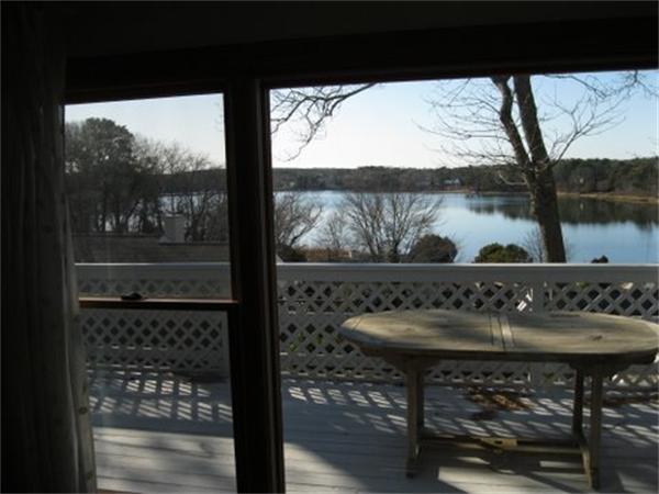 327 Mayfair Road Yarmouth, MA 02675 - Photo 4 of 29 a view of a balcony with table and chairs