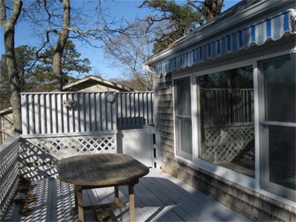 327 Mayfair Road Yarmouth, MA 02675 - Photo 8 of 29 a view of a chair and table in the patio