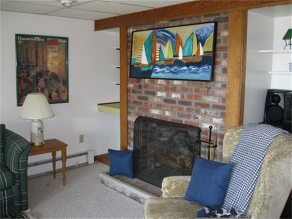 327 Mayfair Road Yarmouth, MA 02675 - Photo 10 of 29 a living room with furniture and a fireplace