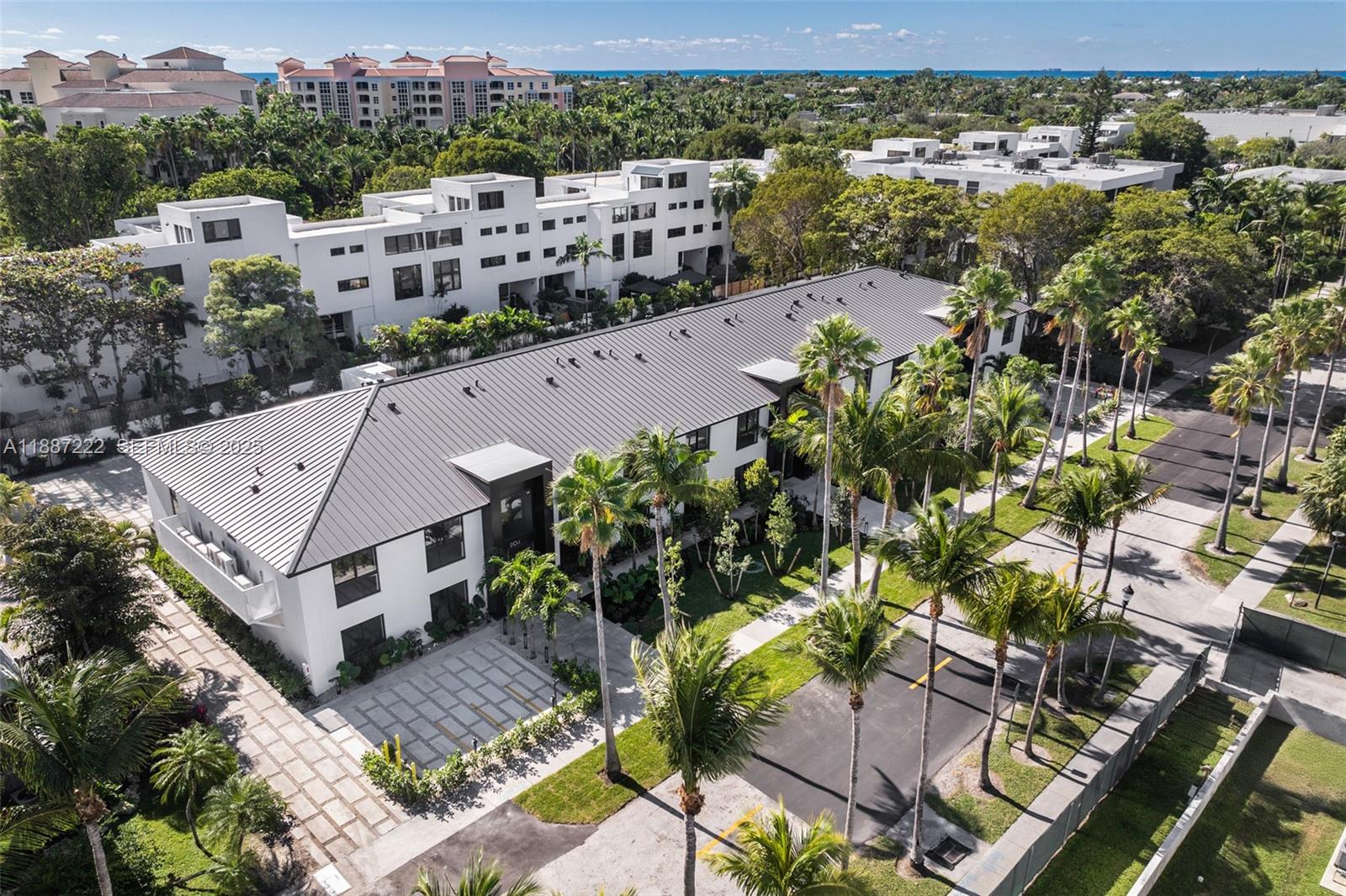202 Sunrise Drive, Unit 202C Key Biscayne, FL 33149 - Photo 1 of 32 an aerial view of multiple houses with a yard