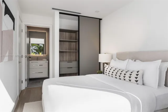 a bedroom with a bed and a cabinets