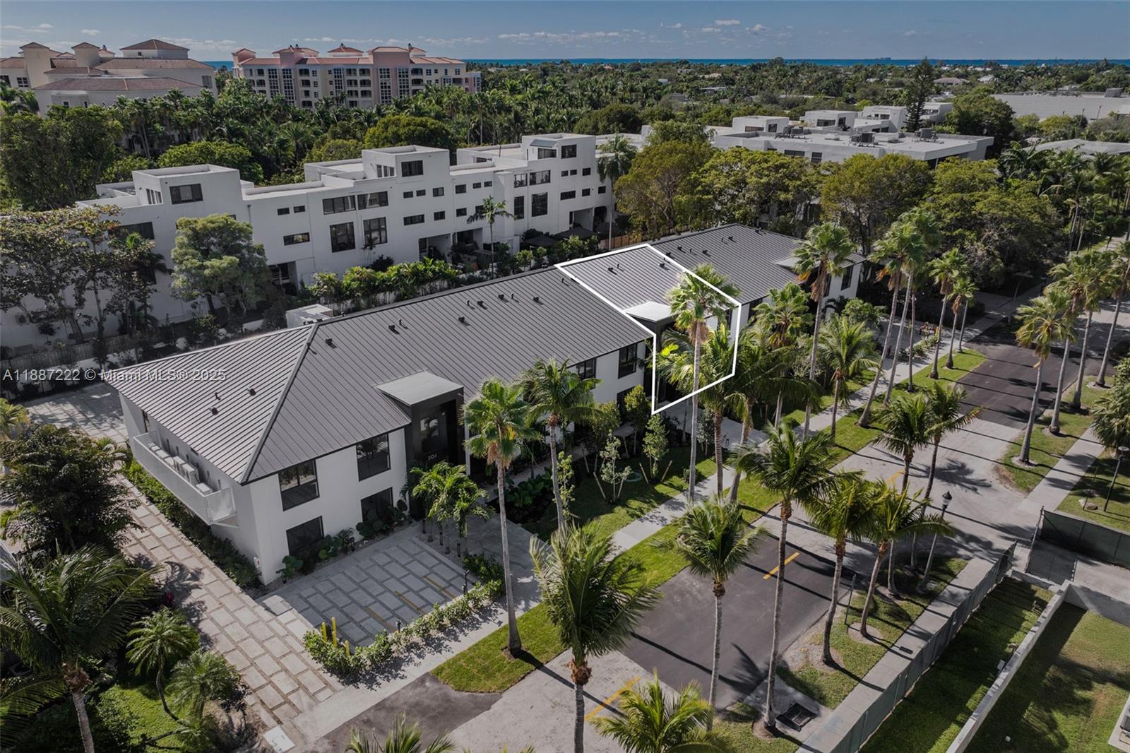 202 Sunrise Drive, Unit 202C Key Biscayne, FL 33149 - Photo 28 of 32 an aerial view of multiple houses with a yard