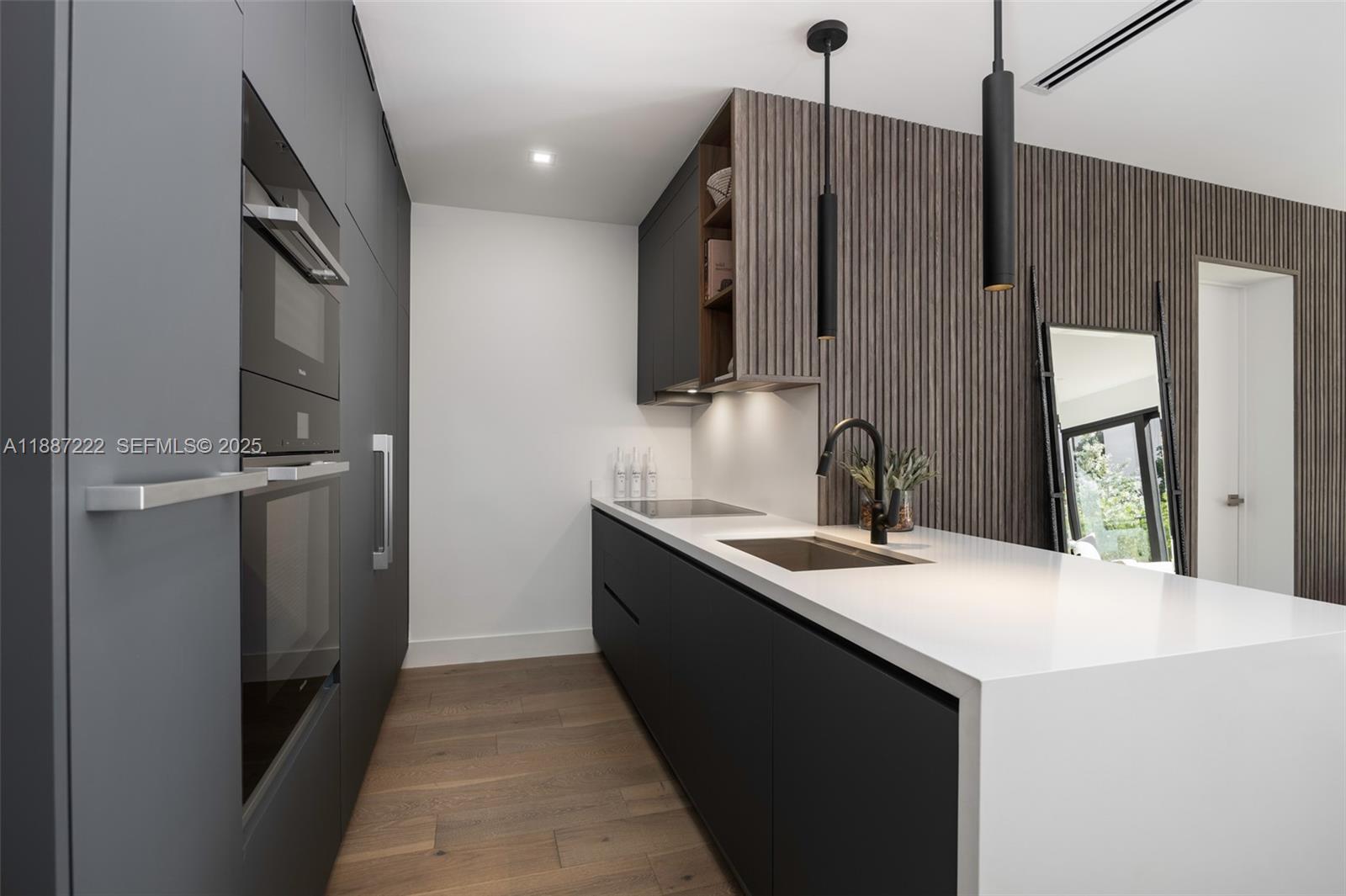 202 Sunrise Drive, Unit 202C Key Biscayne, FL 33149 - Photo 5 of 32 a kitchen with a sink and a refrigerator