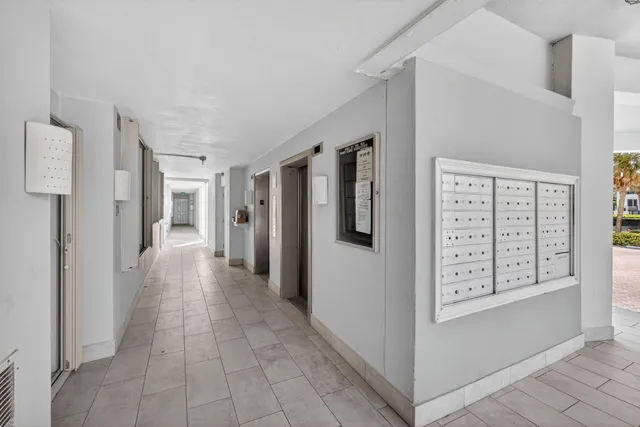 a kitchen with a sink a stove and chairs