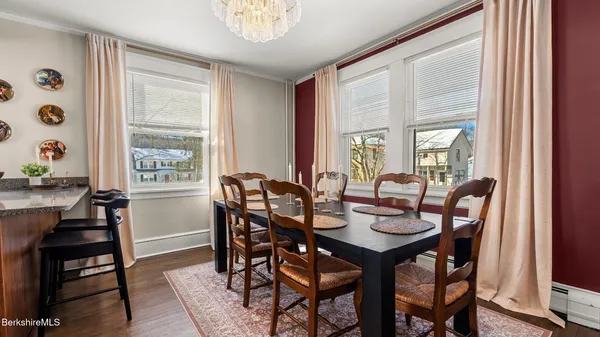 a view of a dining room with furniture and window