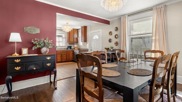 a view of a dining room with furniture and window