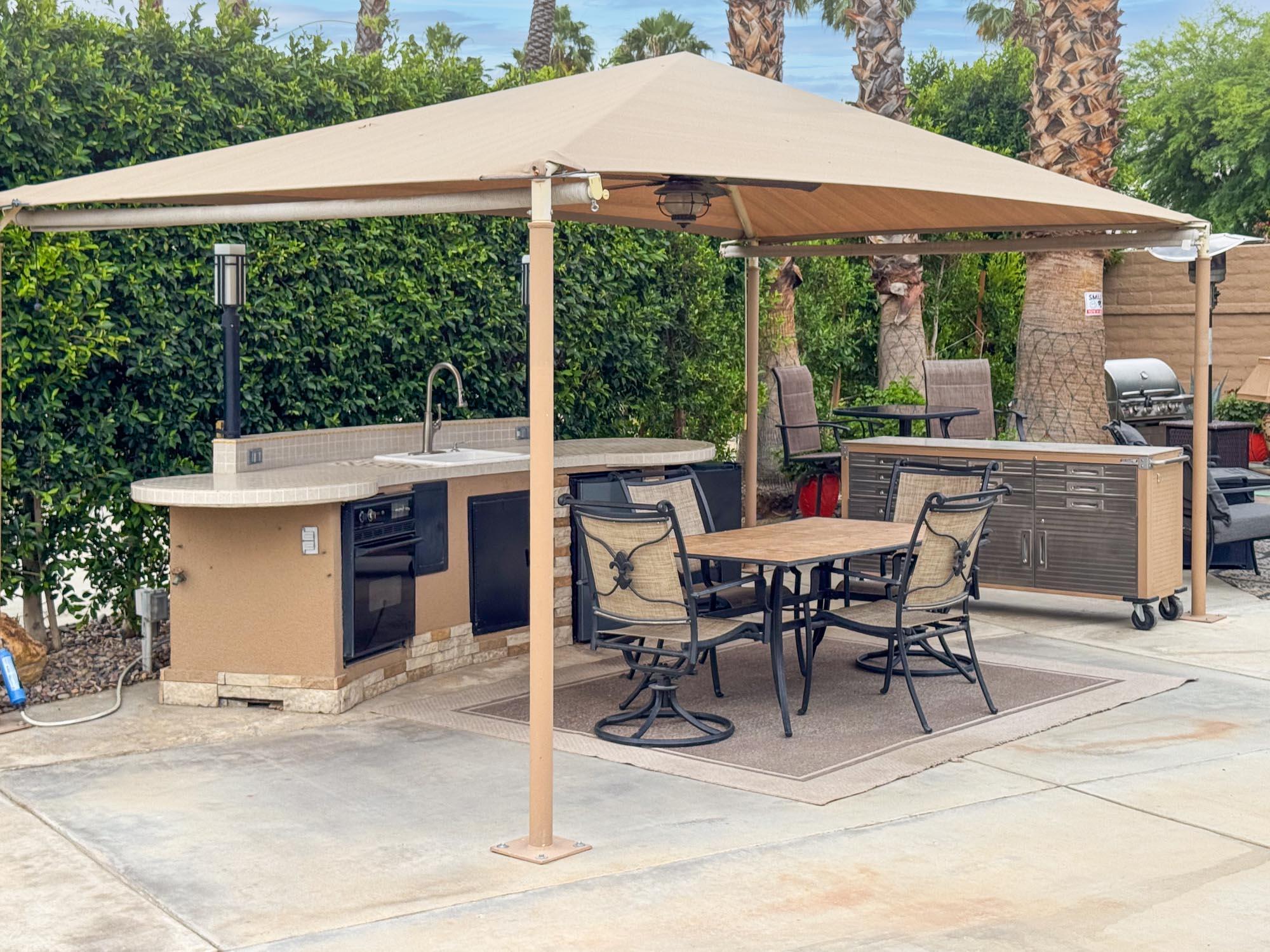 80394 Ave 48, Unit 90 Indio, CA 92201 - Photo 17 of 29 a view of a patio with a table chairs and a table