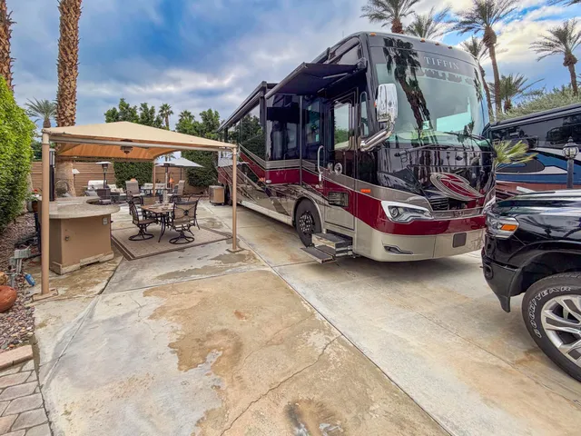 a view of a patio with a table and chairs