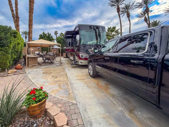 a view of a backyard with sitting area