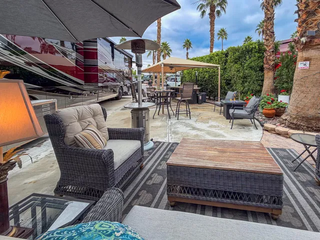 an outdoor sitting area with a table and chairs