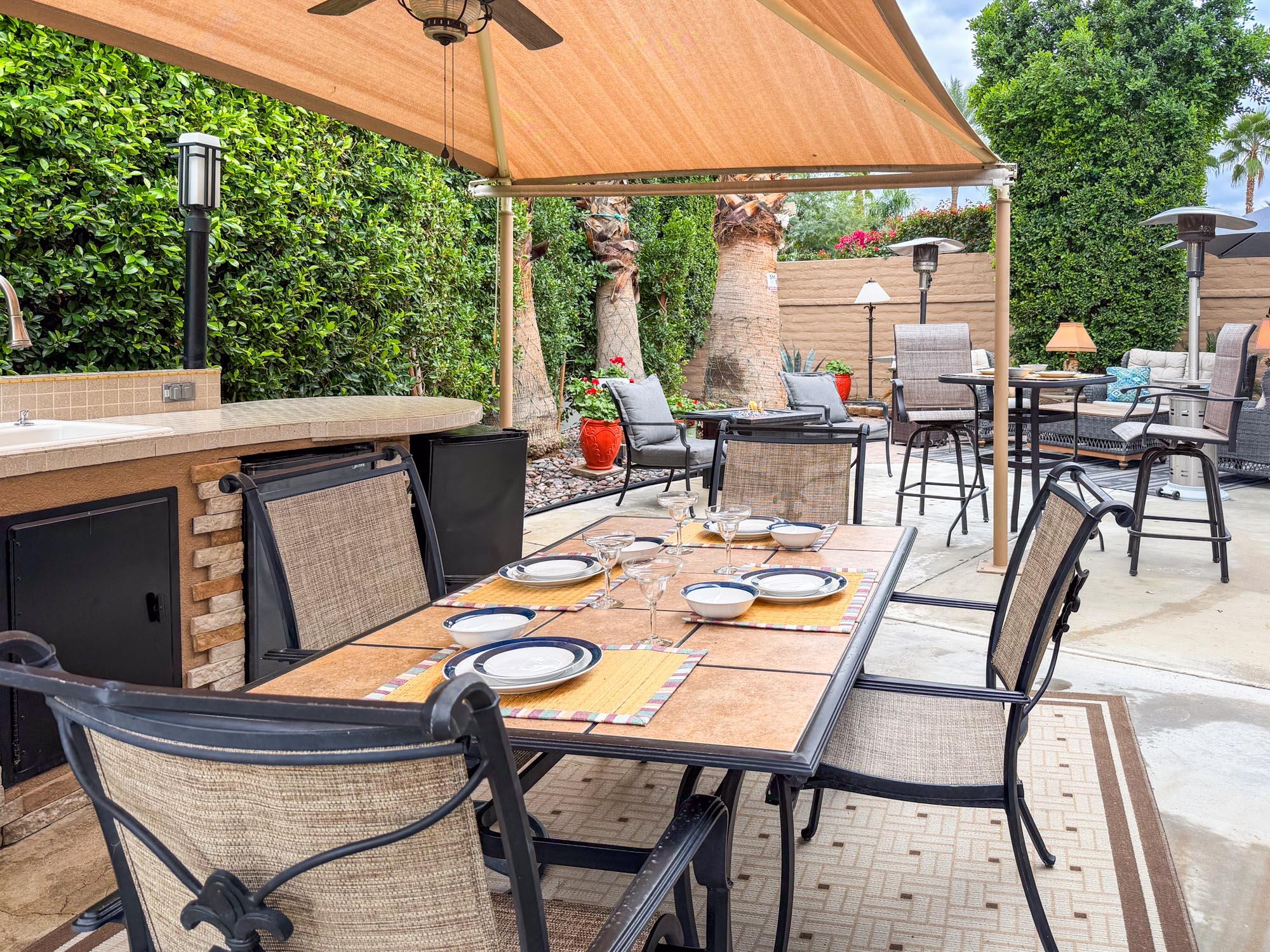 80394 Ave 48, Unit 90 Indio, CA 92201 - Photo 27 of 29 a outdoor dining space with furniture and garden view