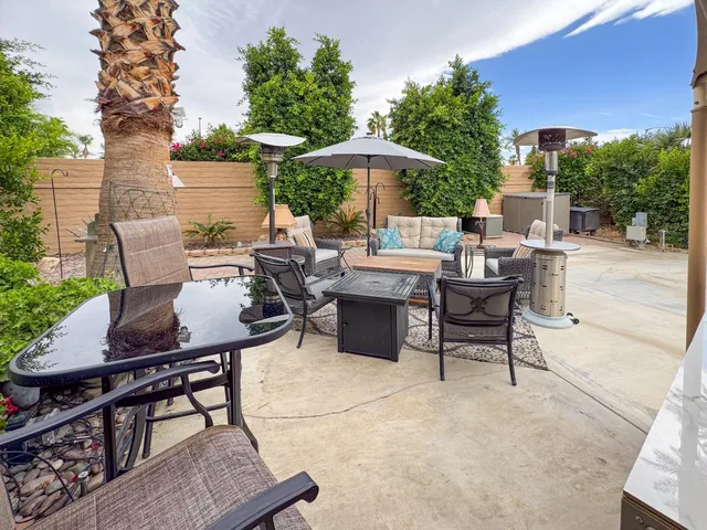 a view of a patio with furniture