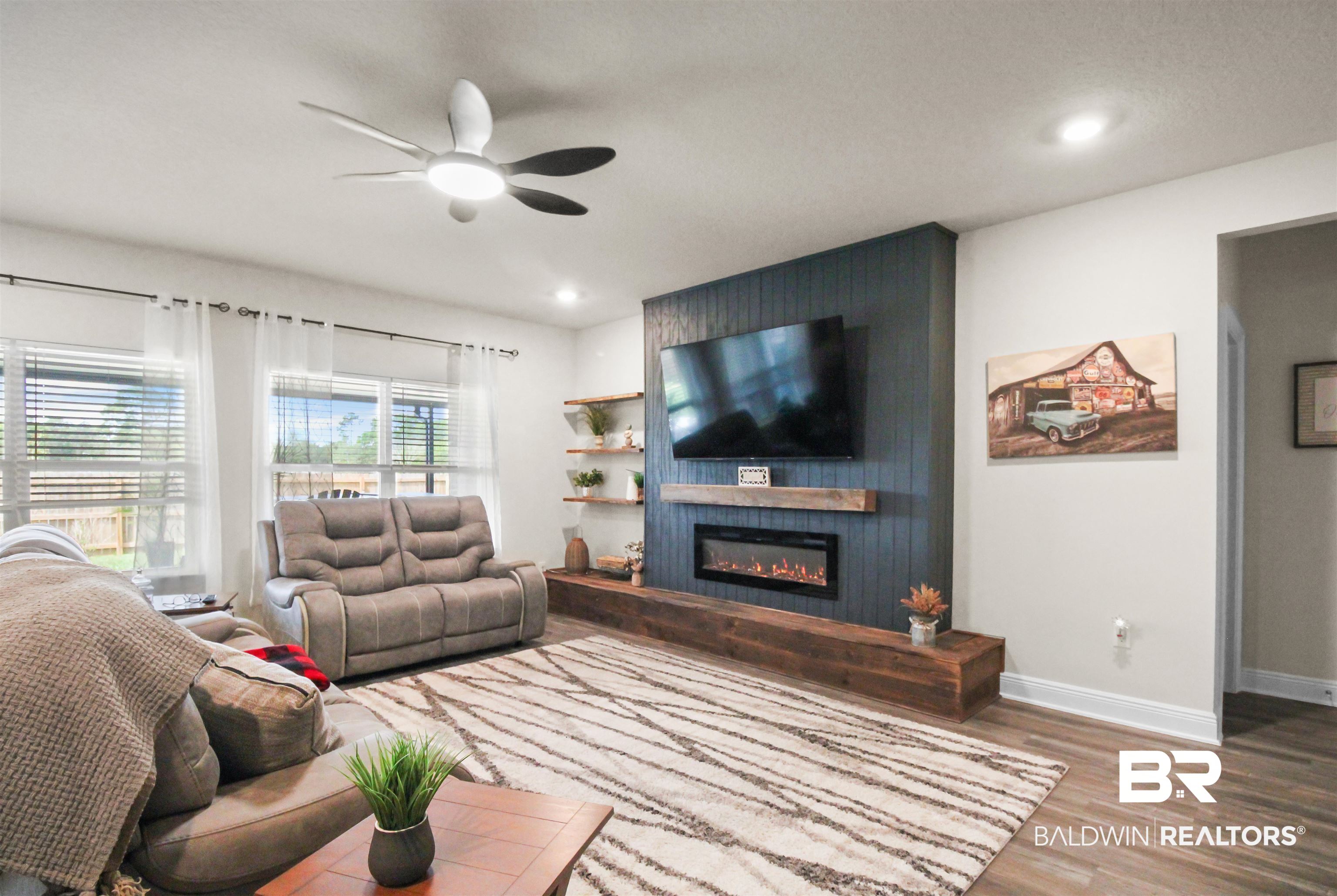 12523 Pheasant Run Elberta, AL 36530 - Photo 15 of 43 Living room featuring wood finished floors, a ceiling fan, recessed lighting, and a fireplace