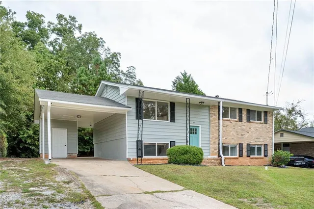 a front view of a house with a yard
