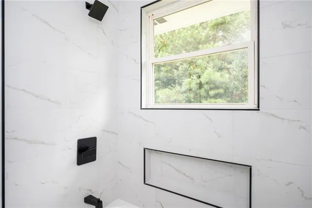a bathroom with sink and mirror
