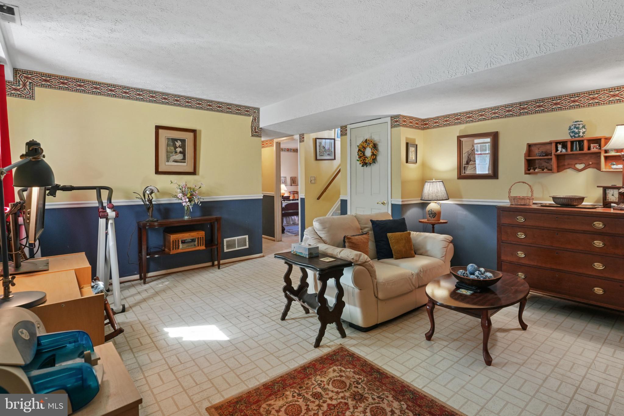 12733 Cunninghill Cove Road Middle River, MD 21220 - Photo 13 of 32 a living room with furniture and wooden floor