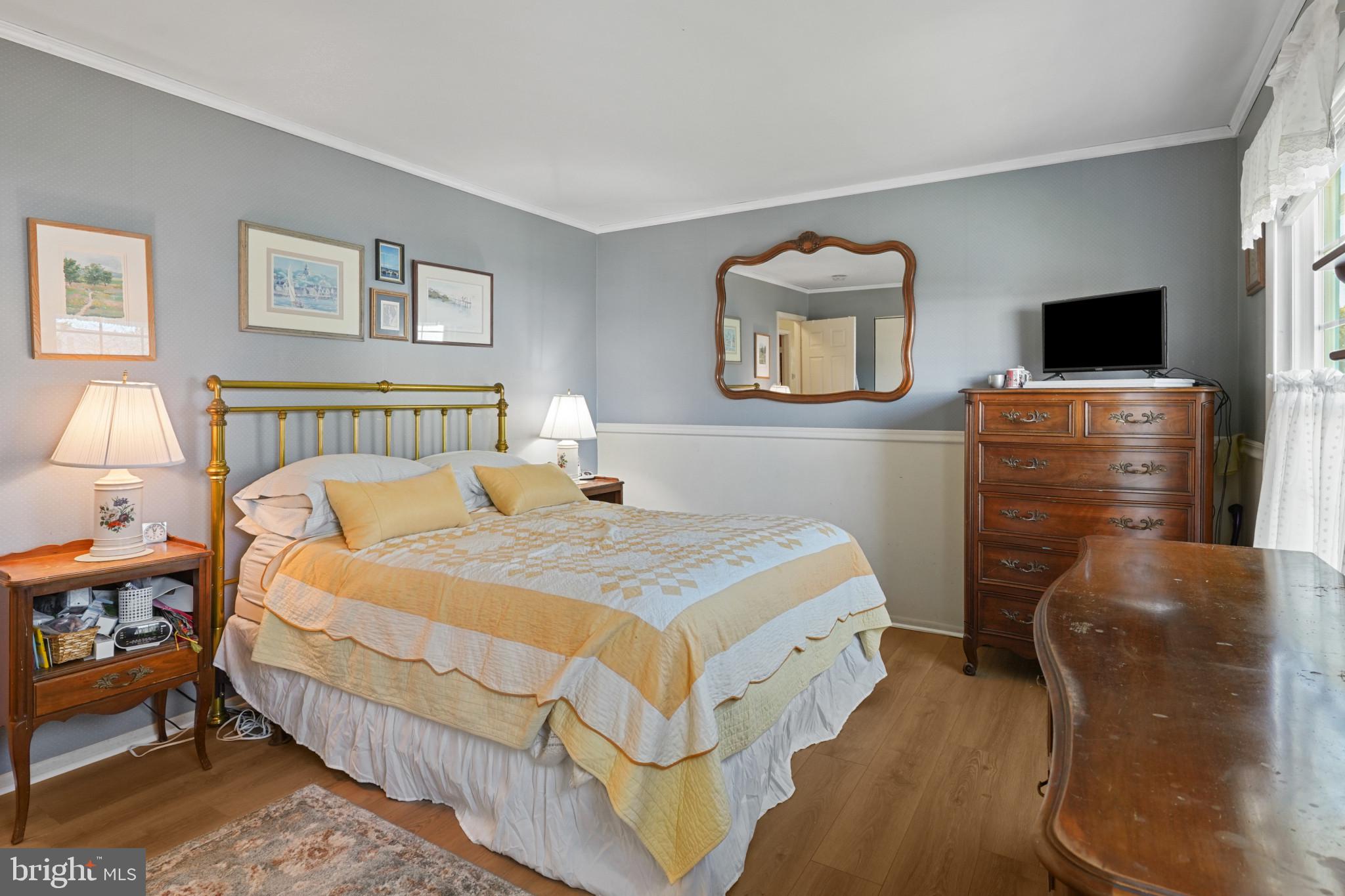 12733 Cunninghill Cove Road Middle River, MD 21220 - Photo 15 of 32 a bedroom with a bed and a tv