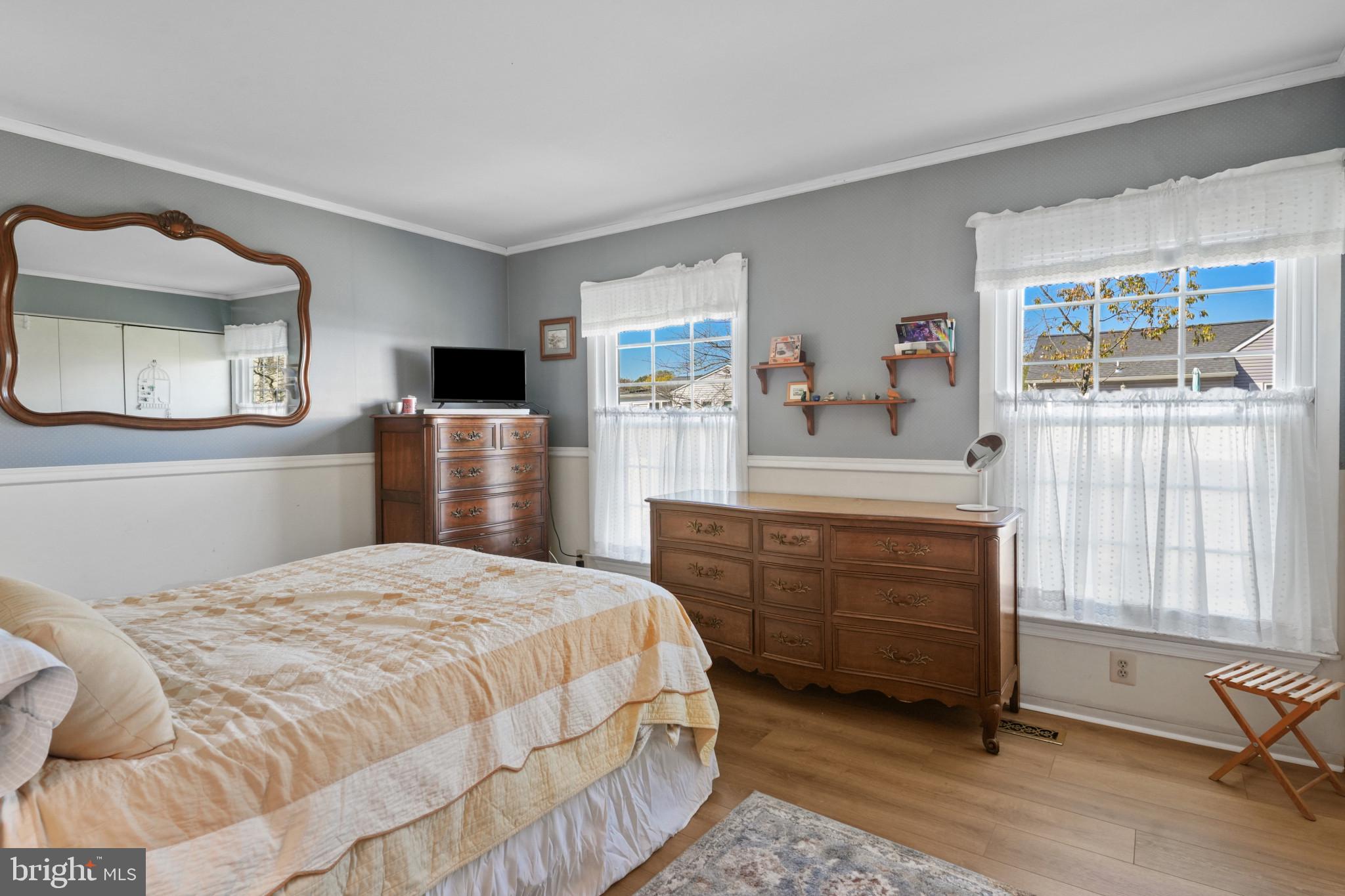 12733 Cunninghill Cove Road Middle River, MD 21220 - Photo 16 of 32 a bedroom with a bed and a dresser