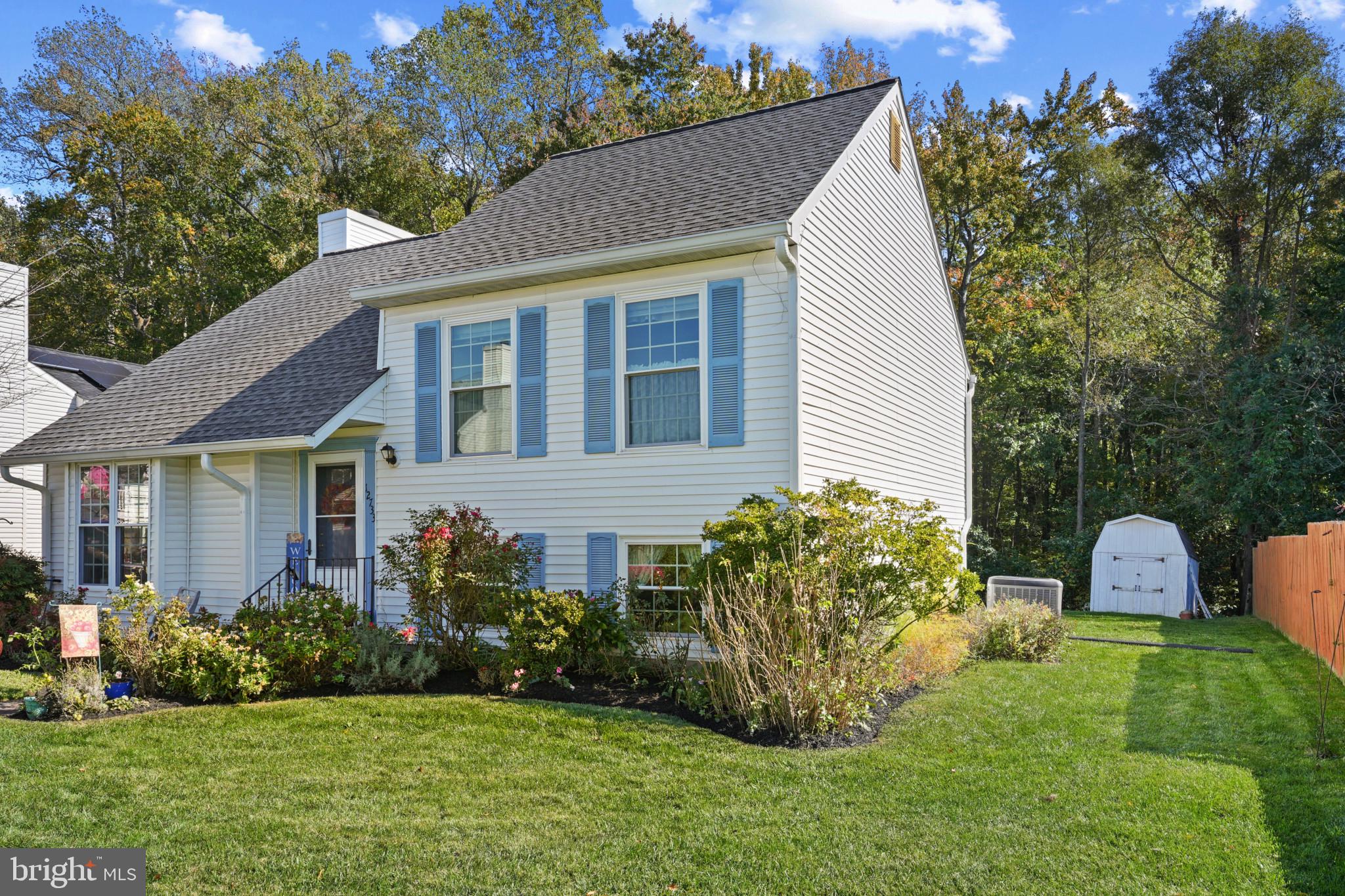12733 Cunninghill Cove Road Middle River, MD 21220 - Photo 2 of 32 a front view of a house with a garden