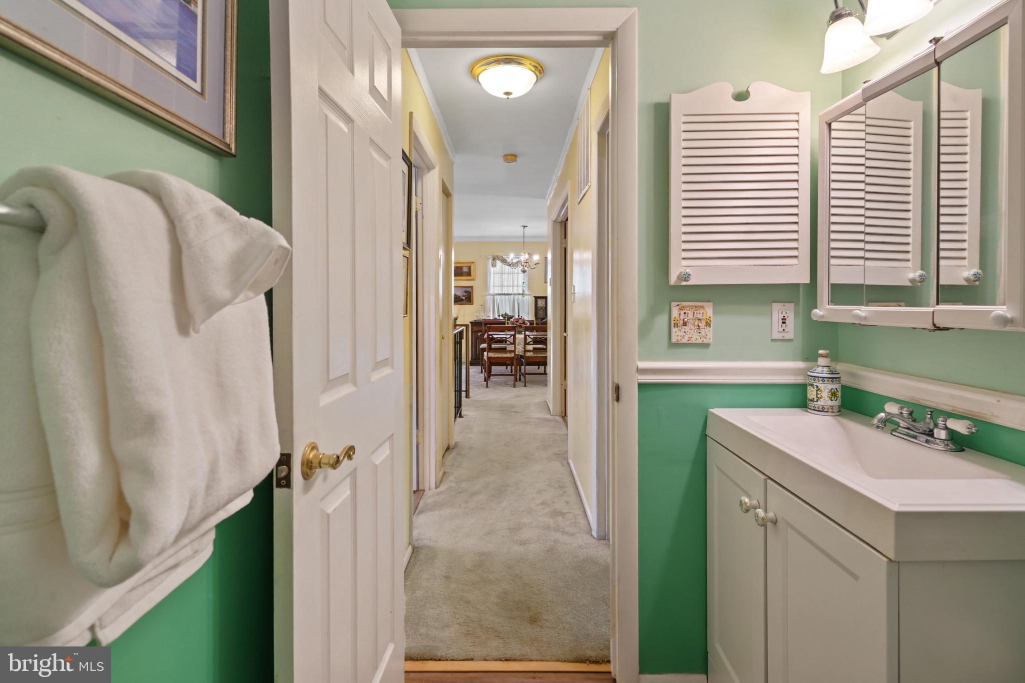12733 Cunninghill Cove Road Middle River, MD 21220 - Photo 24 of 32 a en suite bathroom with a sink a mirror and a shower