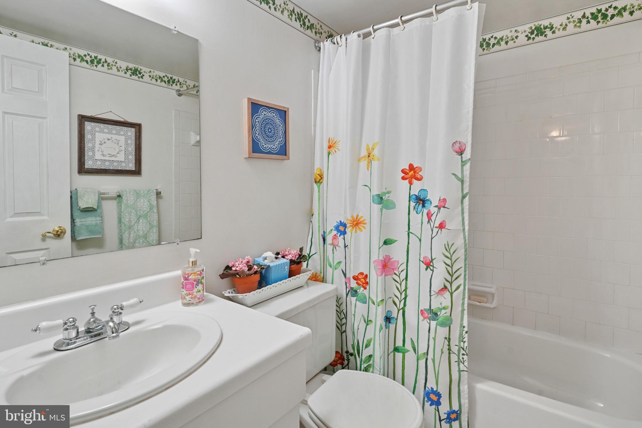 12733 Cunninghill Cove Road Middle River, MD 21220 - Photo 27 of 32 a bathroom with a sink toilet and shower