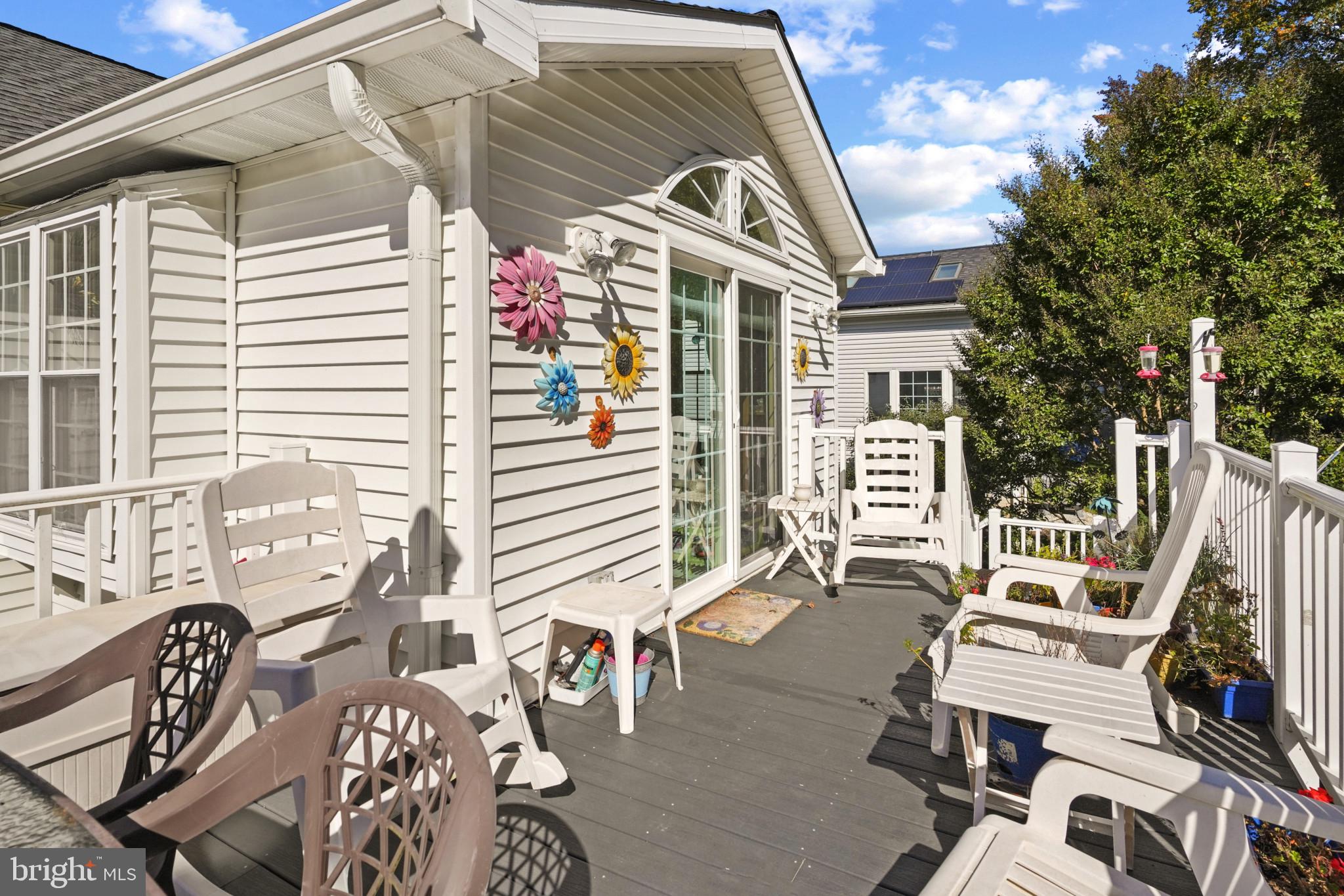 12733 Cunninghill Cove Road Middle River, MD 21220 - Photo 29 of 32 a view of a patio with table and chairs and potted plants