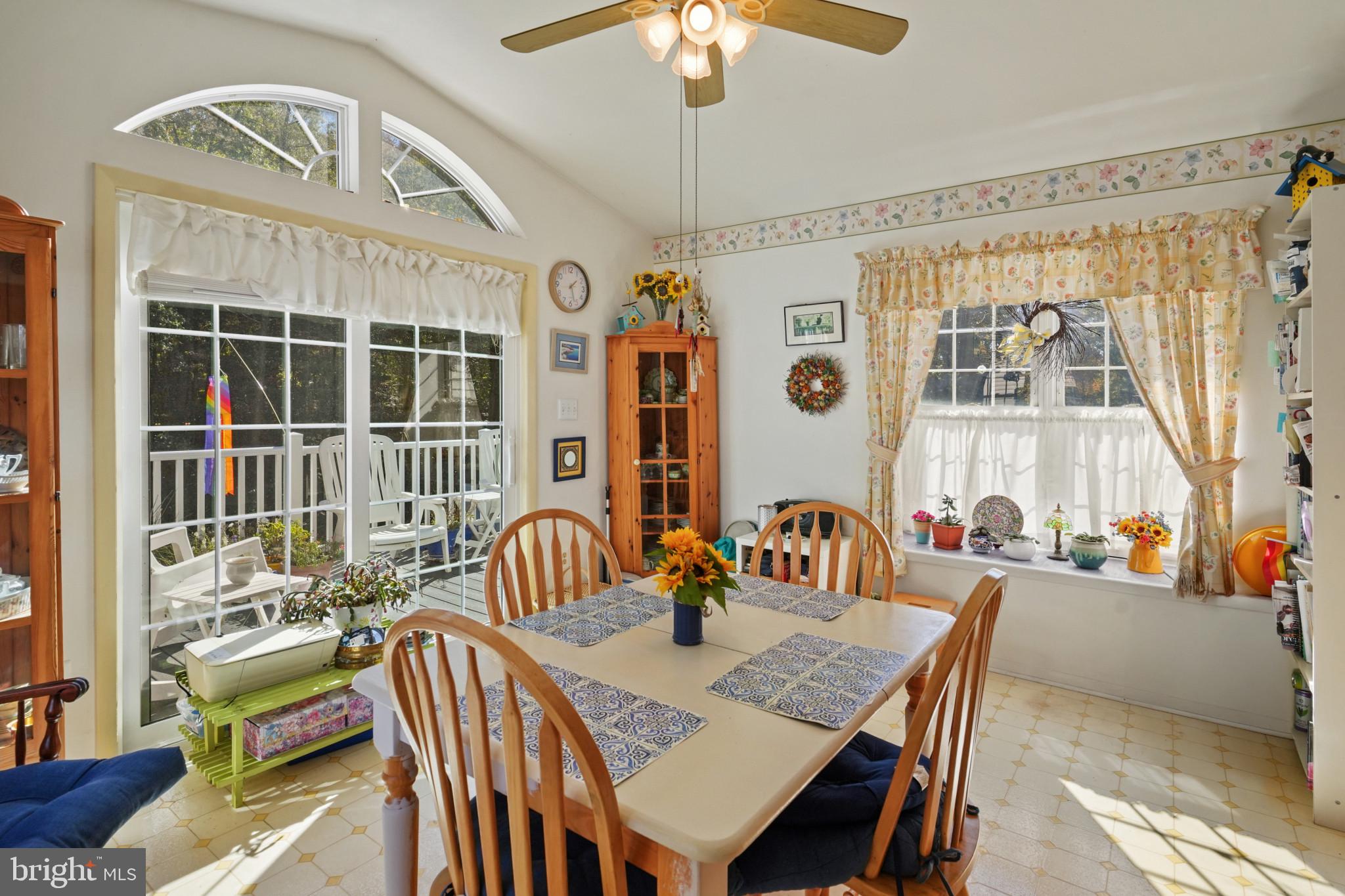 12733 Cunninghill Cove Road Middle River, MD 21220 - Photo 10 of 32 a view of a dining room with furniture window and outside view