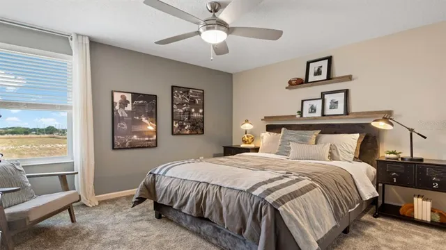 a bedroom with a bed and a chandelier