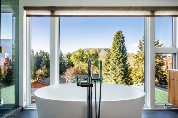 a bath tub sitting in front of a window