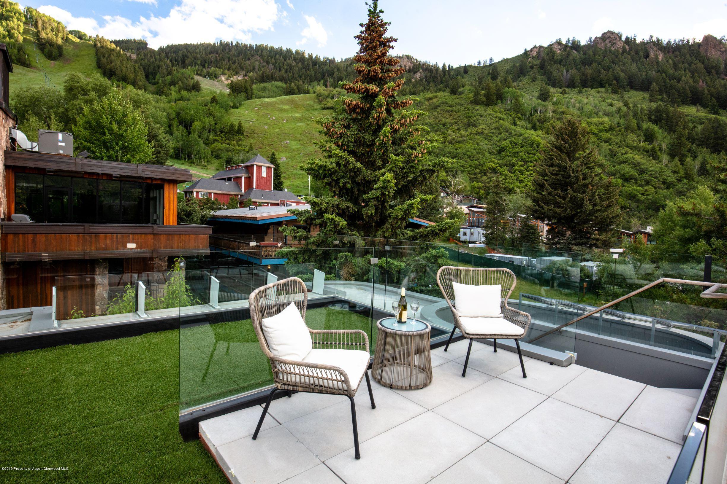 623 South Monarch Street, Unit : A Aspen, CO 81611 - Photo 14 of 22 a view of a chairs and table in the patio
