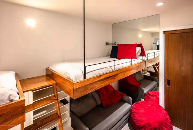 a bed room with a bed and a couch