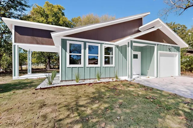 a view of kitchen with granite countertop cabinets and sink