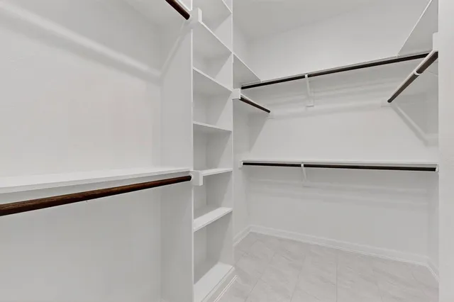 a view of an empty walk in closet