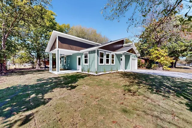 front view of a house with a yard