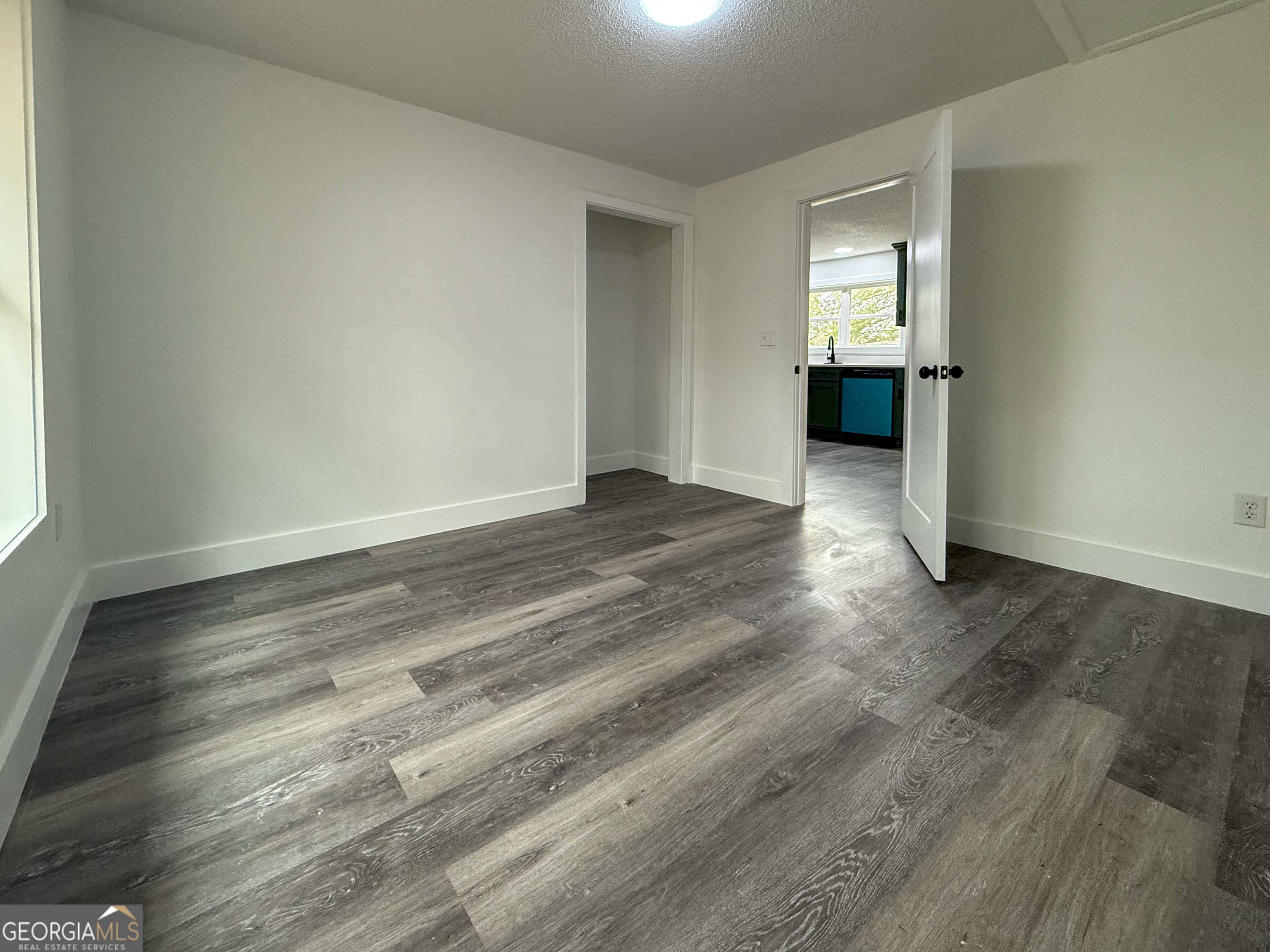 2301 Highway 254 Cleveland, GA 30528 - Photo 11 of 23 a view of empty room with wooden floor and sink