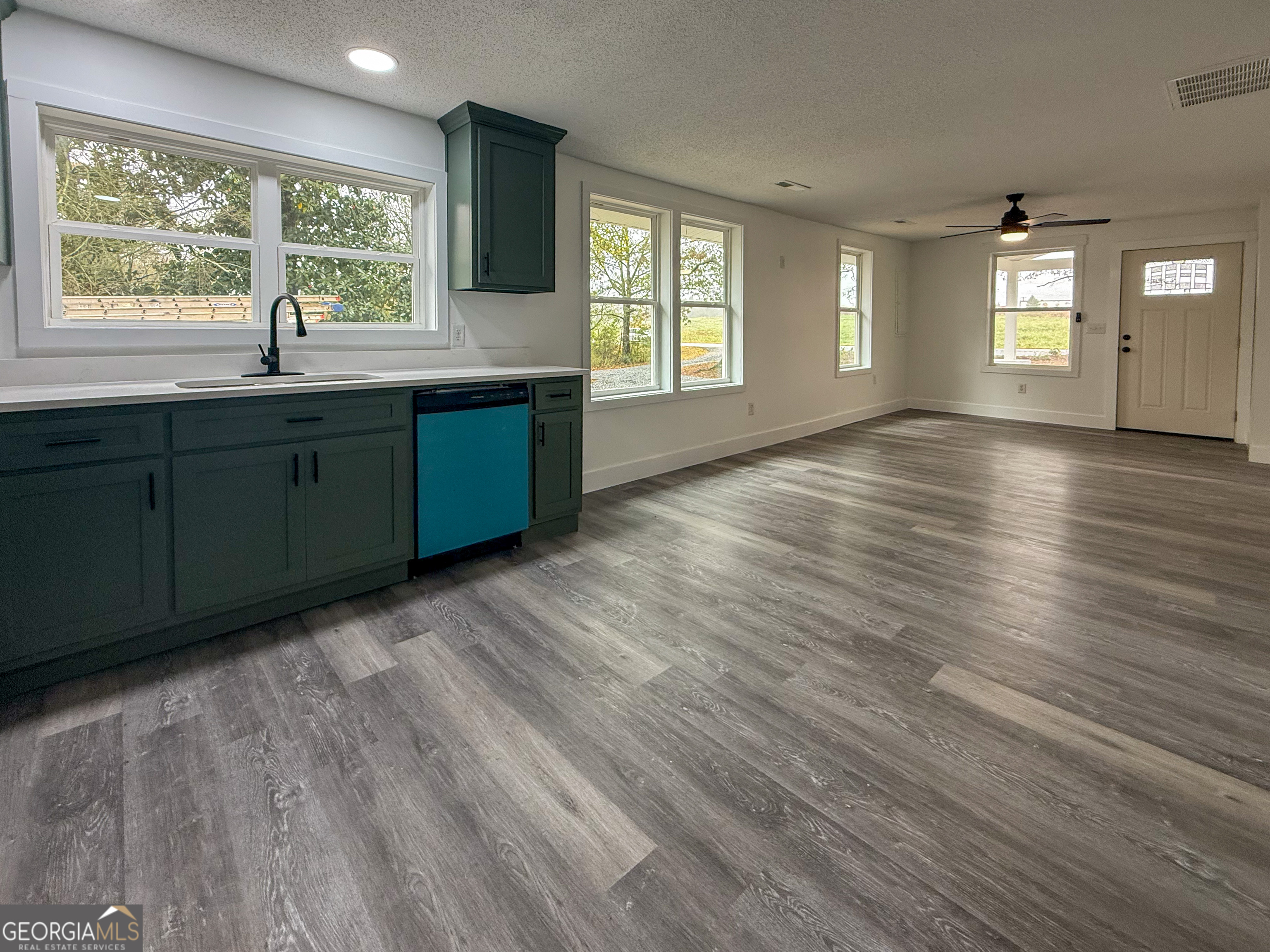2301 Highway 254 Cleveland, GA 30528 - Photo 7 of 23 a room with wooden floors and windows