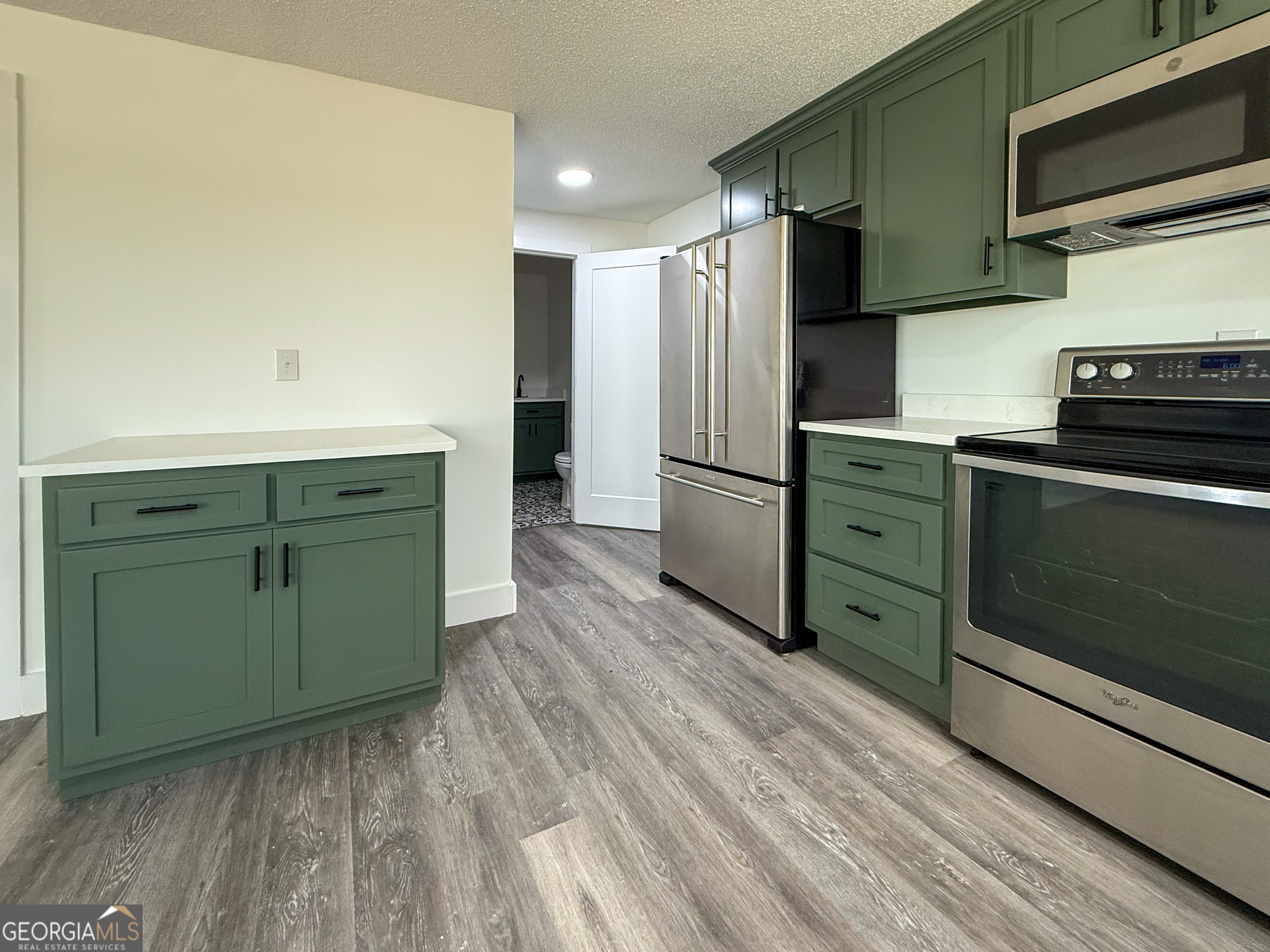 2301 Highway 254 Cleveland, GA 30528 - Photo 9 of 23 a kitchen with a refrigerator and a sink